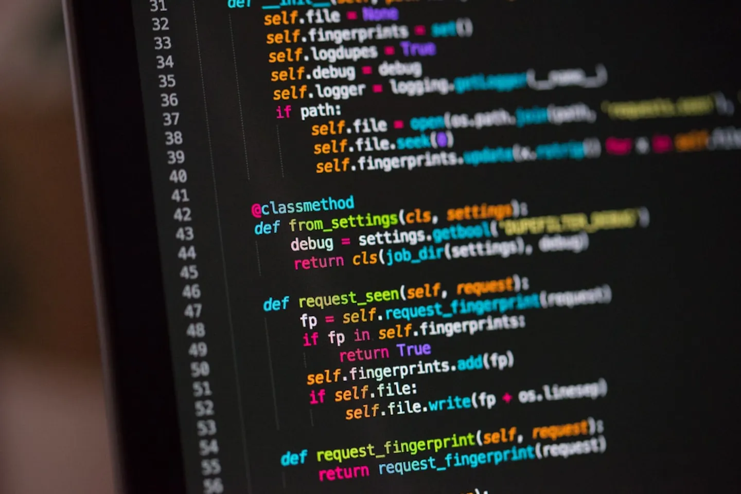Code editor open on a laptop in a developer workspace.